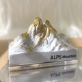 White and grey Alps mountain aroma stone with gold peaks on reflective surface - Bluebell / Gold Mountain