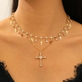 Layered gold tassel necklace with rhinestone cross pendants on a fashion model - Gold Rhinestone Multi-cross (KC Gold 5671)
