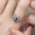 Silver bow-style ring with heart-shaped black gemstone and lava texture finish - Silver Black Heart Lava Ring (N-199)