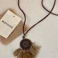 Bohemian woven leather necklace featuring a carved metal disk with beige silk tassels - Light Brown Round