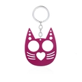 Macro shot of purple cat-shaped metal self-defense keychain with finger holes - Justice Cat Rose Red (K00636-04)