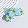 Close-up of three translucent blue plumeria flower hair claws with a matte finish - 6# Peacock Green Gradient Triple Plumeria