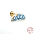 Macro shot of S925 sterling silver gold earring featuring arched blue gemstones - Gold Single #5 (Blue Stone Row)