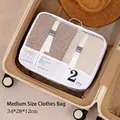 Pearl white mesh travel organizer bag with buckle straps inside a brown suitcase - White-Medium (No. 2)