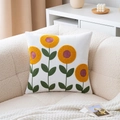 White velvet pillow cover with embroidered sunflowers on a soft beige sofa - Sunflower