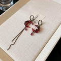 Detail view of asymmetric vintage earrings with red gemstones in a jewelry box - 38# Hoop Earring - Gun Black - Moon