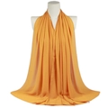 Ginger yellow solid pearl chiffon long scarf draped elegantly on a mannequin - Ginger Yellow