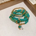 Detail of multi-layer beaded bracelet set with emerald green crystals and gold charms - Blue (4-Piece Set)