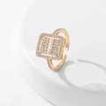 Detail of a square gold ring featuring pink pavé edges and baguette-cut zircon stones - Style 6 / Gold