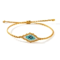 Bracelet Evil Eye tissé doré ajustable avec motifs de fils bleus et blancs fins - Gris foncé