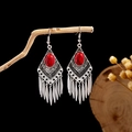 Detail of bohemian silver earrings featuring red turquoise inlay and leaf tassels - E2870-3 Red Rhombus Tassel