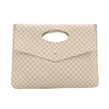 Beige envelope clutch bag with yellow clover pattern and round cutout handle design - White