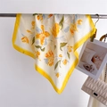 Floral print silk scarf with yellow borders hanging gracefully on a hanger - 70x70cm / Yellow (FJ994-1)