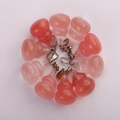 Pink quartz gourd pendant charms with silver bails arranged in circular layout - Watermelon red