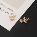 Macro shot of gold-plated angel charms with micro-pave cubic zirconia for DIY jewelry - Angel Style 2
