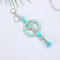 Turquoise floral silicone cross keychain with decorative tassel and rhinestone detail - Turquoise Floral