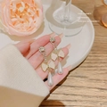 Detail view of pearl drop earrings featuring cream bows and sparkling rhinestones - Gold Creamy Bowknot Pearl