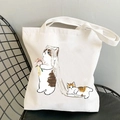 Kawaii white canvas tote bag with cute bride cat illustration on black metal chair - Wedding Dress Cat Bride