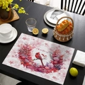Pink Christmas placemat with red bird and floral pattern on a black dining table - CD57-14