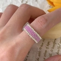 Handmade woven bead ring featuring lavender purple beads with silver-toned edge accents - Purple