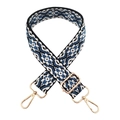 Close-up of bohemian geometric jacquard bag strap with golden metal clasps - White Blue Floral