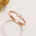 Rose gold layered clover and star stainless steel bangle with diamond accents - Rose Gold
