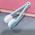 Portable light blue eyeglass cleaning clip with microfiber pads on red book - Light Blue