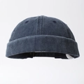 Vista dettagliata del cappello docker in denim lavato blu scuro con cuciture a sei pannelli - Taglia unica / Blu scuro