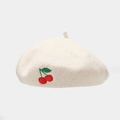 Close-up of embroidered cherry detail on a creamy white wool beret for women - One Size / Beige