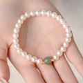 Freshwater pearl bracelet featuring a turquoise barrel stone and golden accents - Fresh Pearl Jade Gold Spacer Style