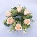 Artificial rose candle ring with champagne pink flowers and green leaves on white background - Champagne