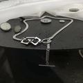 Unisex silver OT clasp chain necklace with geometric interlaced links on a dark surface - Steel Clasp Style (A-0210)
