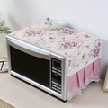Close-up of linen microwave dust cover with floral patterns and pink lace pleat edging - Purple With Camellia