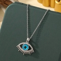 Collier Mauvais Œil en argent avec gemme bleue et zircons sur boîte à bijoux - A19-argent