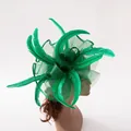 Detail of emerald green feather fascinator with mesh veil on mannequin head - Grass Green