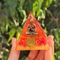 Orgone pyramid with Buddha statue, red flower petals and golden crystal base - Style 12