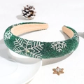 Detail of green sponge headband with sparkling rhinestone snowflake patterns and pine cone - Green