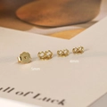 Detail view of 925 sterling silver earring backs in gold finish with S925 hallmarked stamp - 4mm / Gold