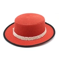 Detail of red boater straw hat featuring faux pearl and white lace ribbon decoration - Red Lace Pearl Style