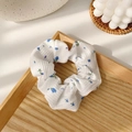 Retro scrunchie with blue floral pattern and lace trim on white textured fabric - Blue Small Flower Scrunchie