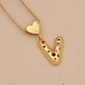 Detail of gold letter V necklace pendant with colorful zircon stones and heart buckle - Letter V / Gold
