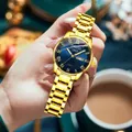 Elegant gold quartz watch with a deep blue sunray dial and gold Roman numerals - Roman All Gold Blue Dial Women's
