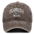 Detailed macro view of white Florida Miami 1822 3D embroidery on washed cotton baseball cap - Coffee