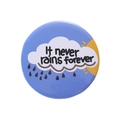 Cartoon enamel pin badge with sun and rain clouds and It never rains forever quote - Blue Cloud