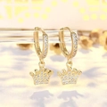 Golden crown hoop earrings with white cubic zirconia pavé on a transparent display - Gold Crown