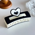 Rectangular hair claw clip featuring a 3D black and white heart design for women - Black