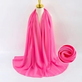 Elegant solid pink pearl chiffon scarf for women shown on a professional display model - Pink