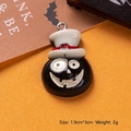Detailed view of Halloween resin pumpkin pendant with white top hat on orange background - White Hat Black Ghost