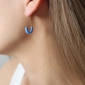 Chic gold safety pin earring with blue enamel finish shown on model for a trendy look - Blue/Gold