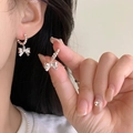 Detailed close-up of silver beaded hoop earrings with a delicate bow pendant charm - 20# Ear Buckle - Silver Bow Beaded